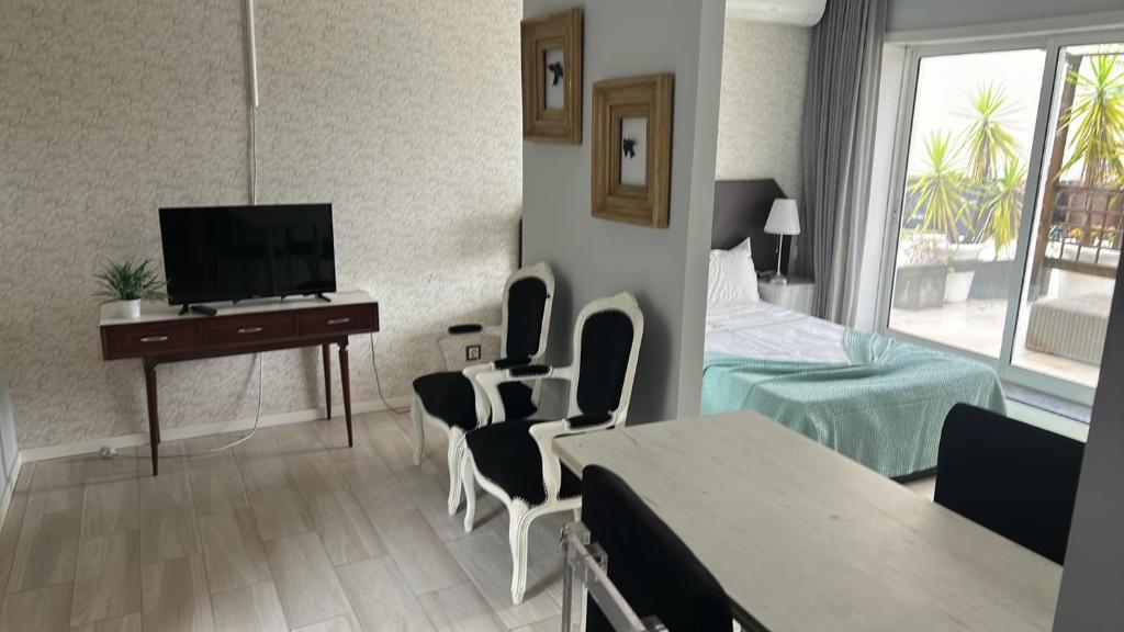 a hotel room with a bed and a table and chairs at Bragaterrace in Braga