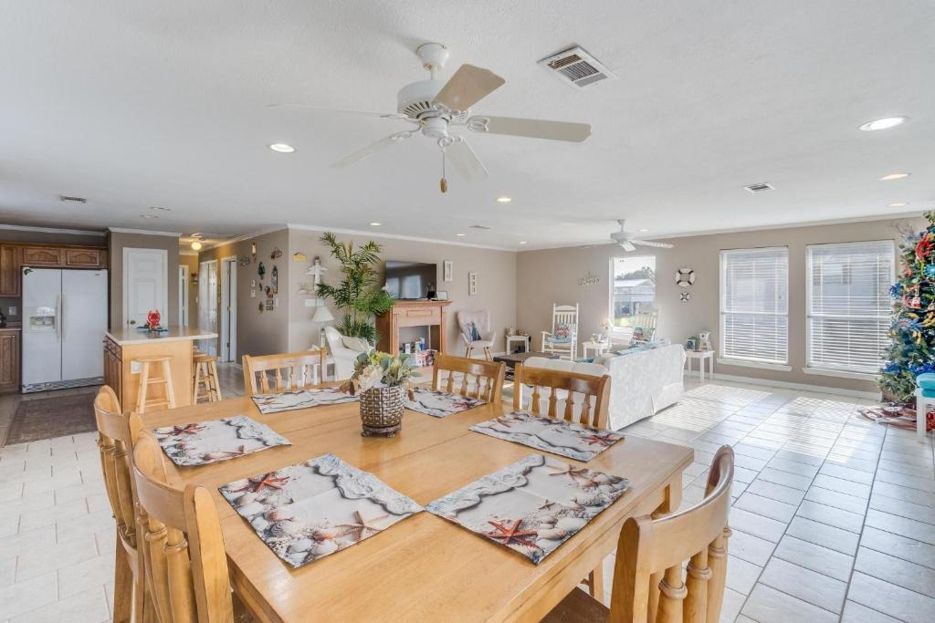 a dining room and living room with a table and chairs at Riverfront Rendezvous by Next Step Property Management in Kiln