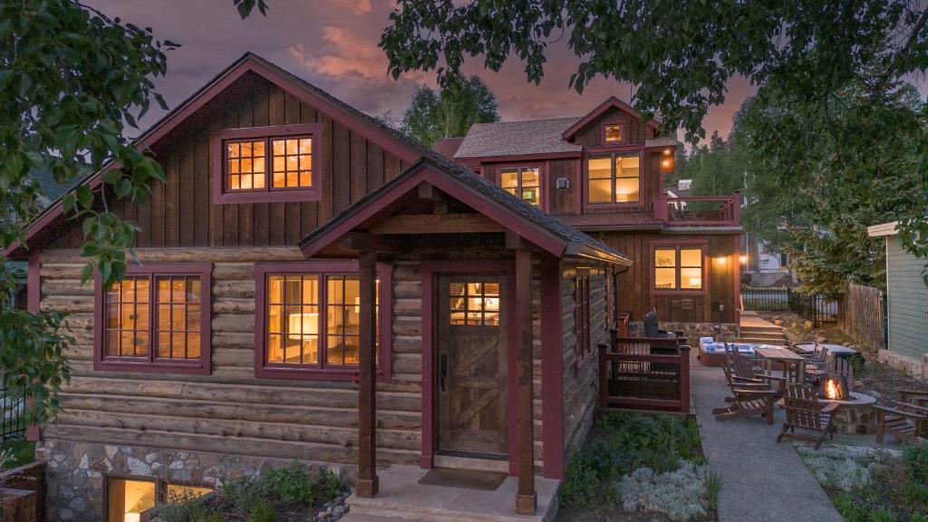 a log cabin with a porch and a patio at Harris House in Breckenridge