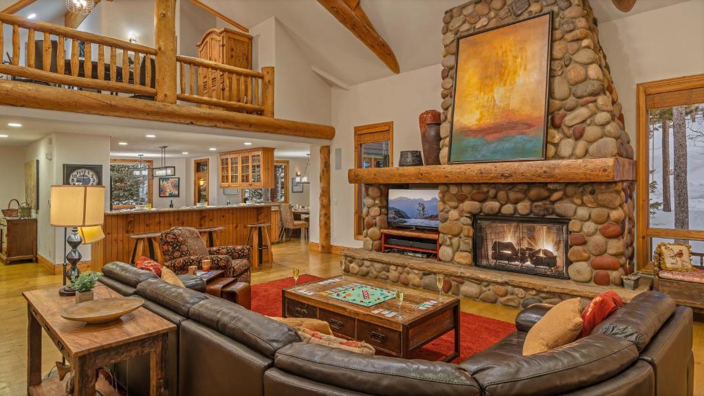 a living room with a couch and a fireplace at Inglenook in Breckenridge