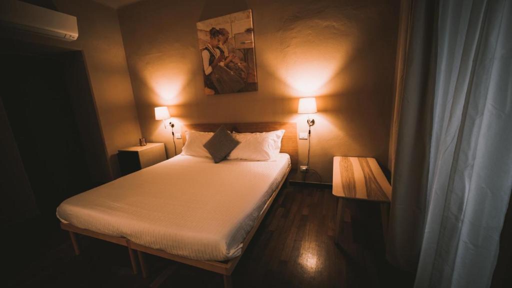 Ένα ή περισσότερα κρεβάτια σε δωμάτιο στο holidays rooms Fazio