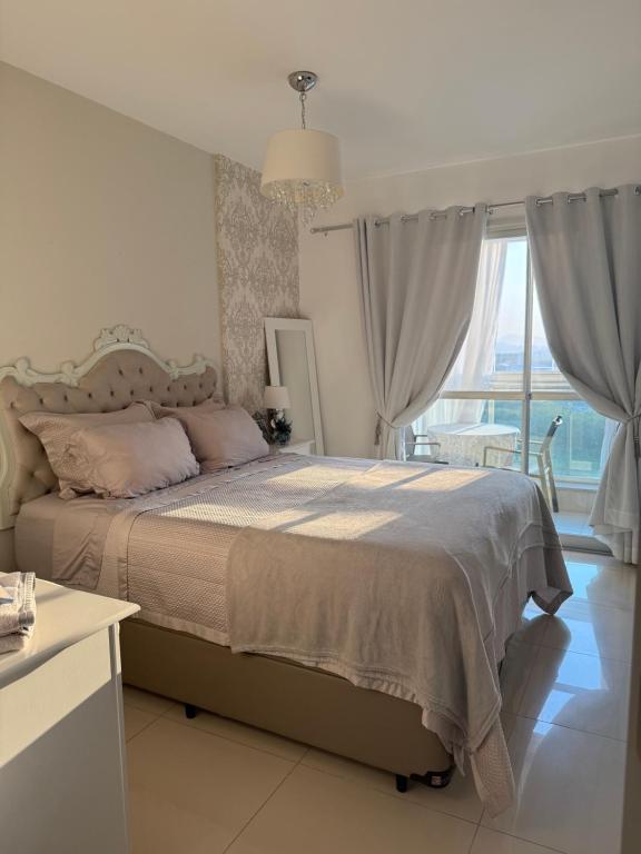 Ένα ή περισσότερα κρεβάτια σε δωμάτιο στο Union Suítes