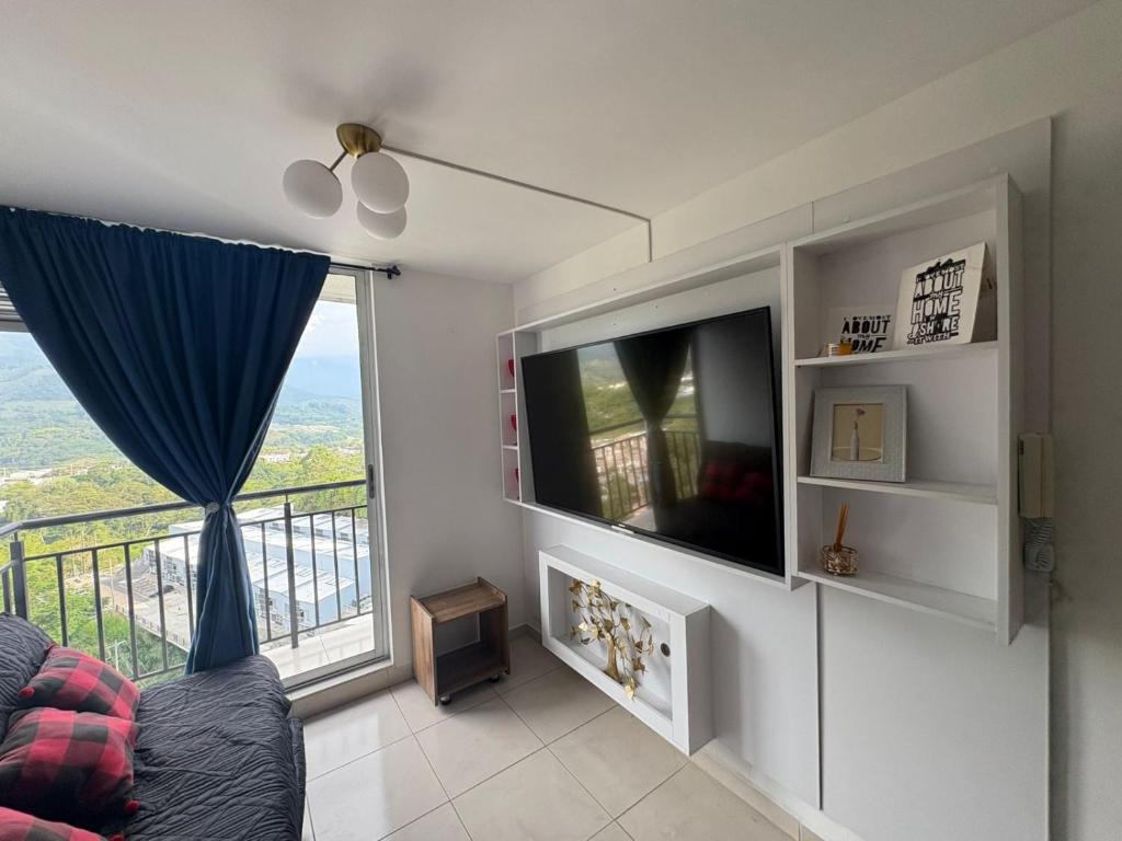 TV a/nebo společenská místnost v ubytování Apartamento 1403 San Luis Rey