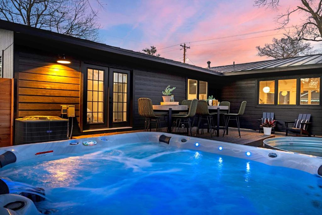 a hot tub in the backyard of a house at Mojito Haus with Hot tub in Fredericksburg