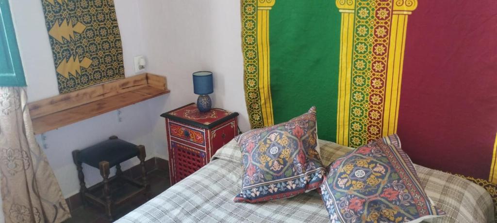 a living room with a couch with pillows on it at BED FOR 2 IN TYPICAL AREA I in Córdoba