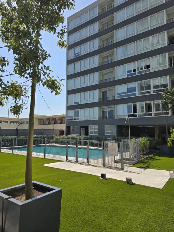 Бассейн в Moderno y elegante departamento en el centro de la ciudad или поблизости