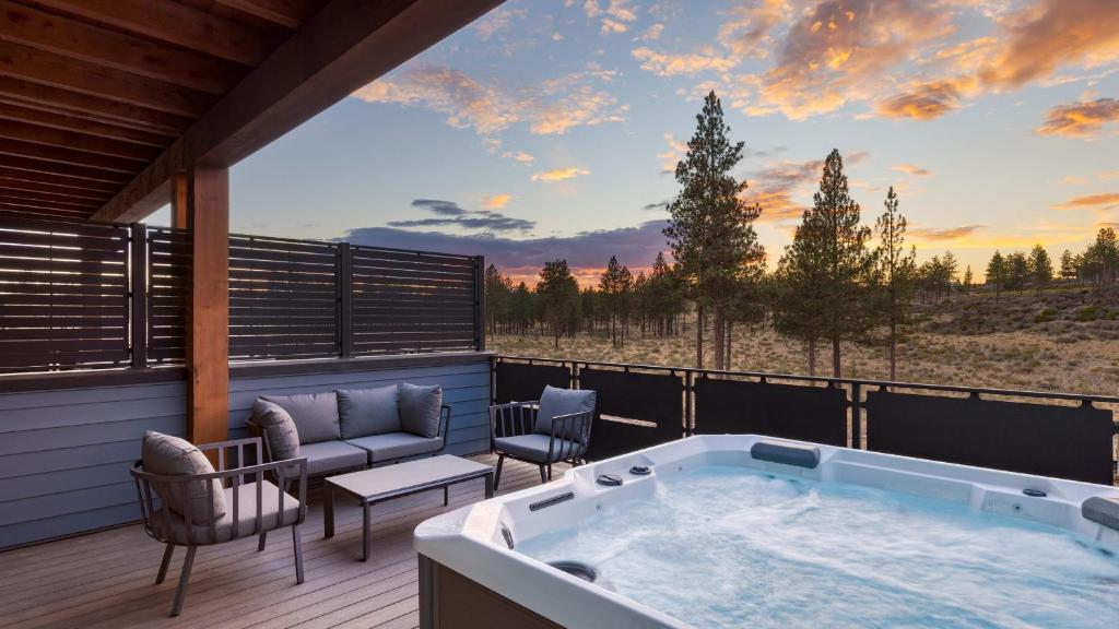 a hot tub on the deck of a house at 1115 Aerie Buyout 2 Units Near Downtown Hot Tub Mountain View in Bend