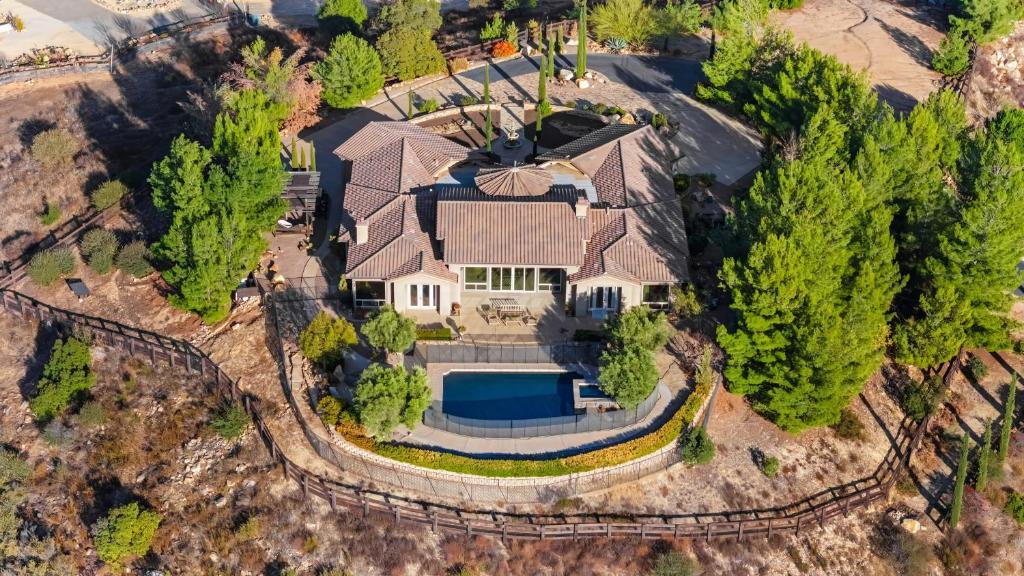 an aerial view of a house with a pool at Cleveland Vista by AvantStay Pool Hot Tub Fire Pit Panoramic Views in Murrieta