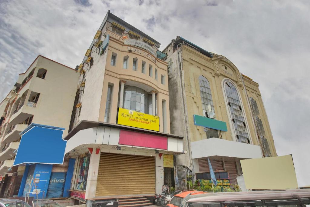 a building with a yellow sign on the front of it at Hotel O Rahul International Hyderabad in Hyderabad