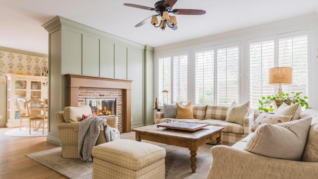 a living room with a couch and a fireplace at Spacious 4BR Home w Fireplace Work Space Backyard Dining in San Diego