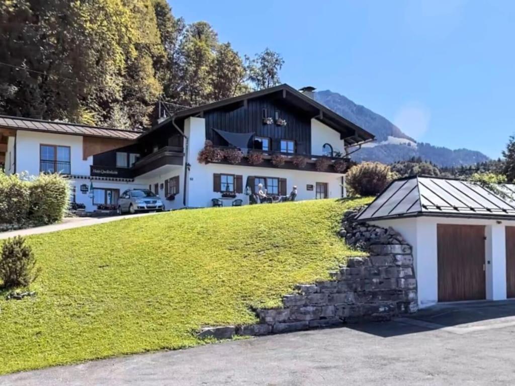 a house on a hill with a garage at Time out at the mountain spring in Mitterbach