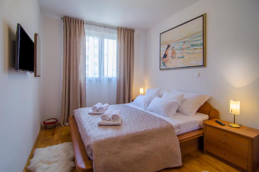Posteľ alebo postele v izbe v ubytovaní Harmony Apartment
