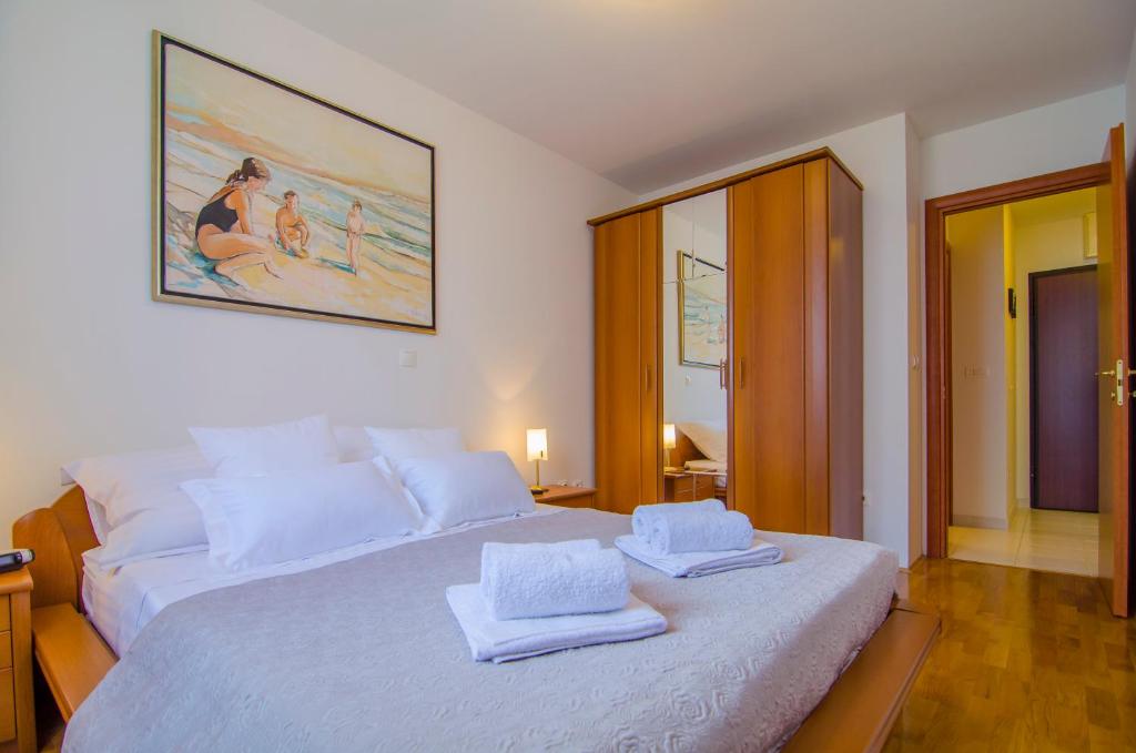 Posteľ alebo postele v izbe v ubytovaní Harmony Apartment