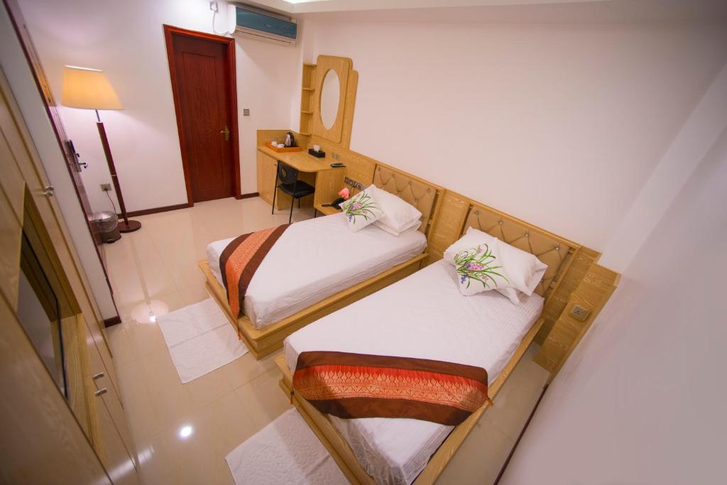 Postel nebo postele na pokoji v ubytování Hathaa Beach Maldives