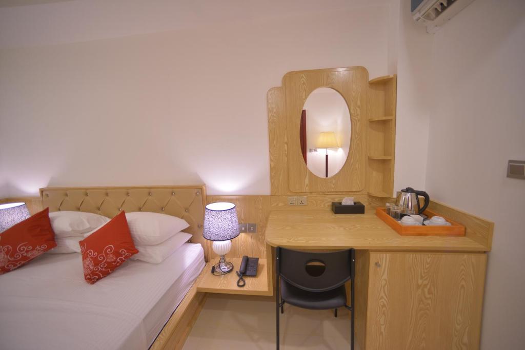 Postel nebo postele na pokoji v ubytování Hathaa Beach Maldives