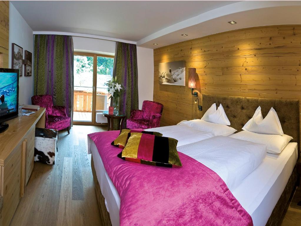 Postel nebo postele na pokoji v ubytování Hotel Gotthard