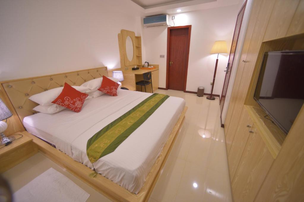 Postel nebo postele na pokoji v ubytování Hathaa Beach Maldives
