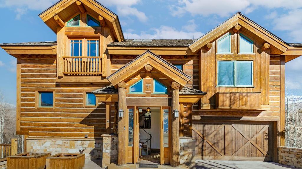 a log home with a front door and a balcony at Adams Ranch Retreat by AvantStay Free Shuttle 2 Mountain Village Telluride Ski Resort in Telluride