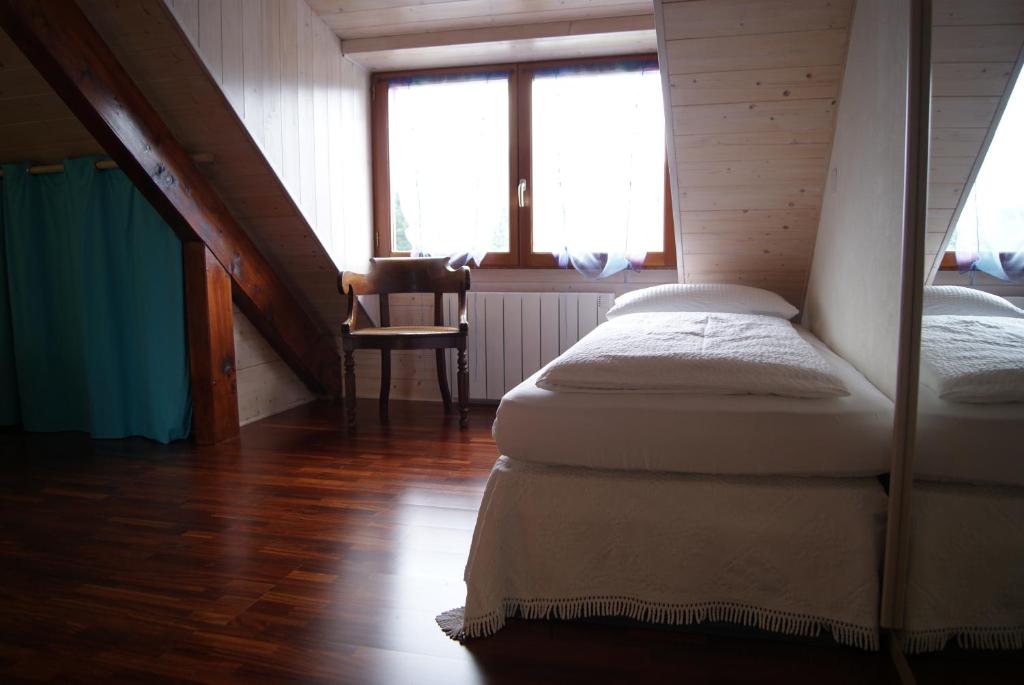 Postel nebo postele na pokoji v ubytování B&B Le Sourire du Lac