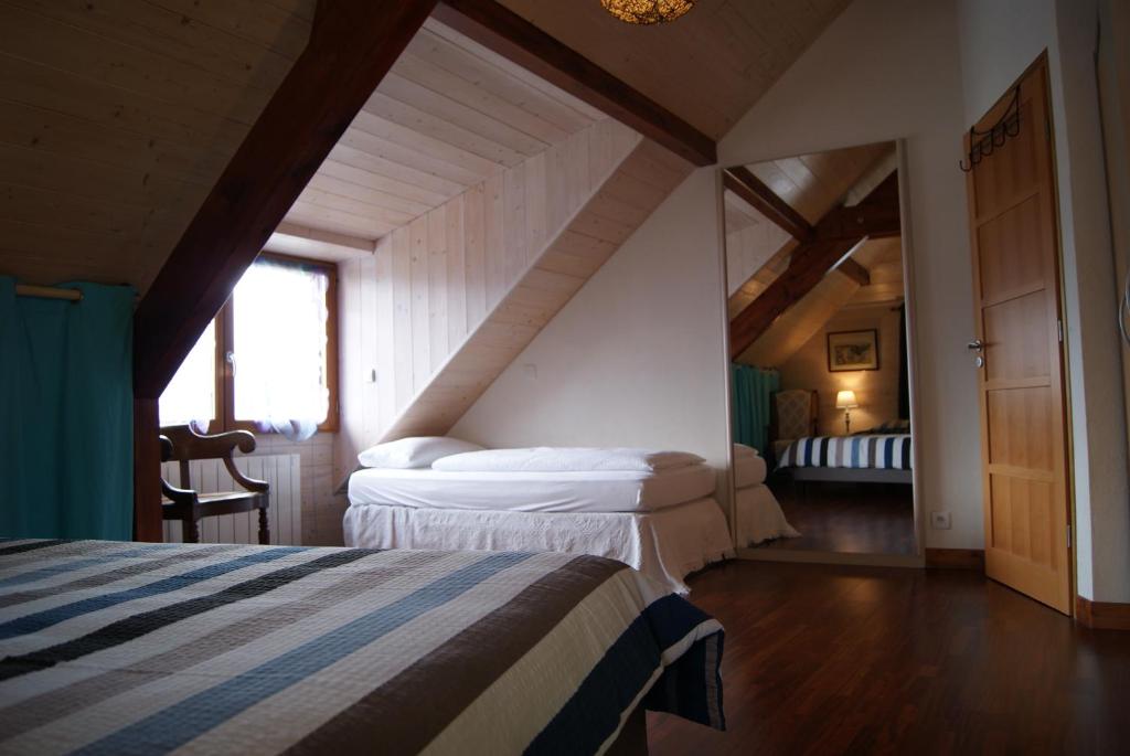 Postel nebo postele na pokoji v ubytování B&B Le Sourire du Lac