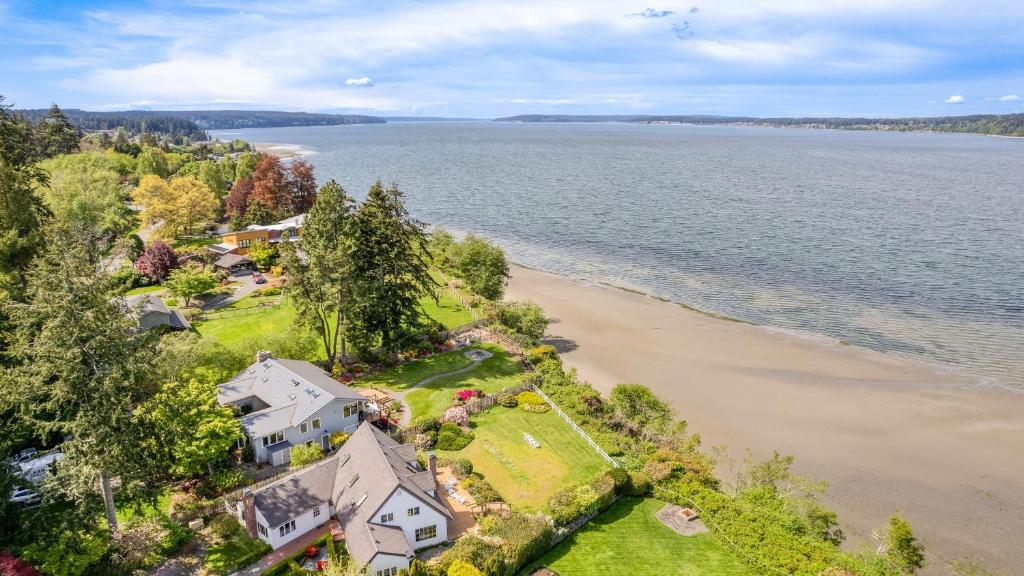 an aerial view of a house next to the beach at Colonial Bluff House Above the Sea by AvantStay in Langley