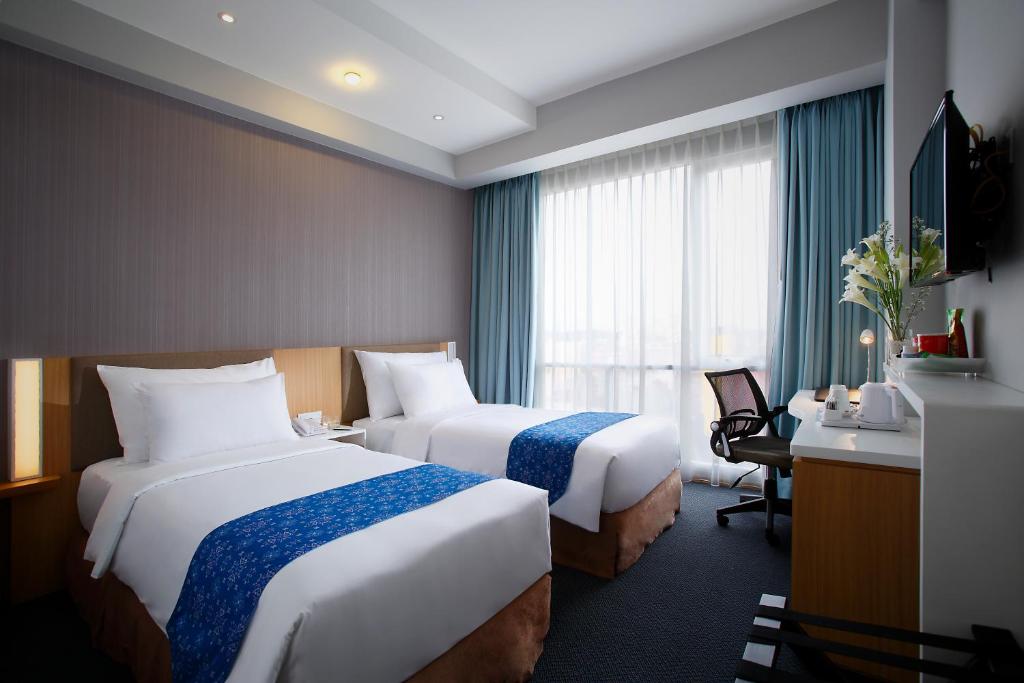 Katil atau katil-katil dalam bilik di Hotel Grandhika Setiabudi Medan