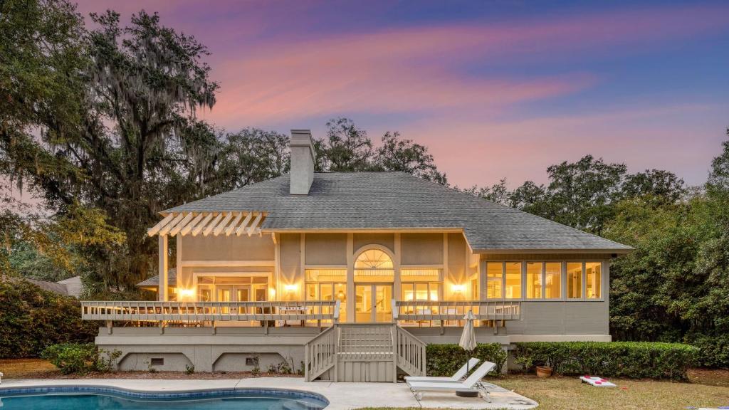 a house with a pool in front of it at Hilton Ivory 15th Hole of Harbourtown Golf Course Private Pool Hot Tub in Hilton Head Island