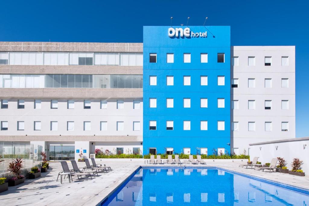 a view of the one hotel with a pool at One Puerto Vallarta Aeropuerto in Puerto Vallarta