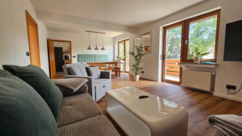 a living room with a couch and a table at Quartier Levi in Oberhausen