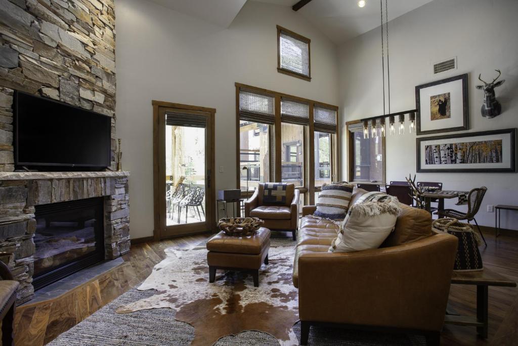 a living room with a couch and a fireplace at 3 Bedroom Condo with Spa - Silver Baron Lodge condo in Park City