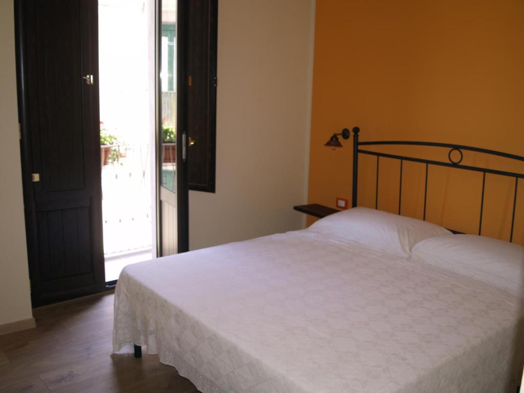 Postel nebo postele na pokoji v ubytování B&B Mamma Elena
