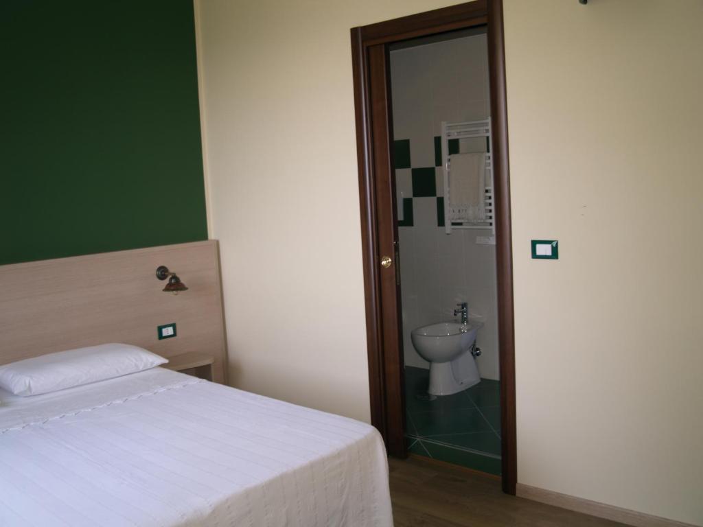 Postel nebo postele na pokoji v ubytování B&B Mamma Elena