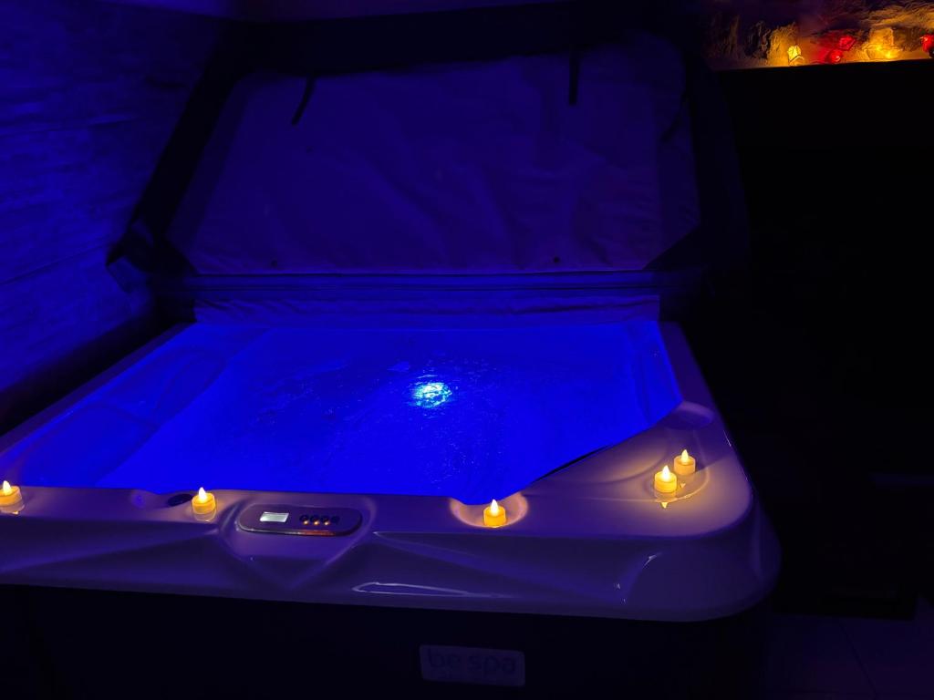 a car with lights in a dark room at La parenthèse secrète in Danvou