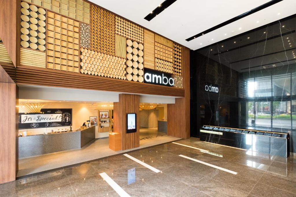 a lobby of a shopping mall with a store at amba Taipei Songshan in Taipei