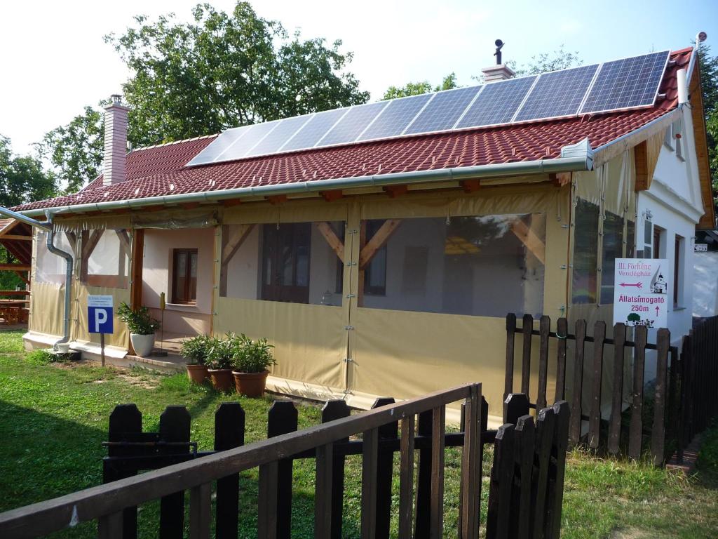a house with solar panels on the roof at Förhénc Wine House & Guesthouses I-II-III in Nagykanizsa
