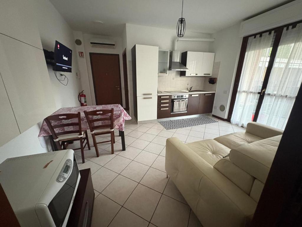 a living room with a couch and a table at la iaia's home in Rozzano