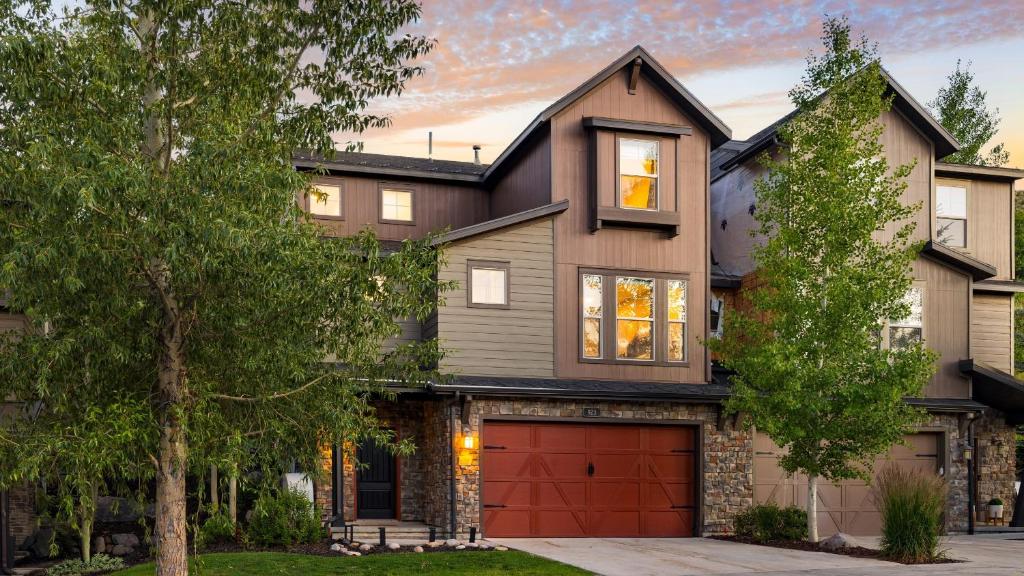 a house with a red garage at Abigail Drive Year-Round Retreat with Hot Tub Near Park City Adventures Skiing in Heber City
