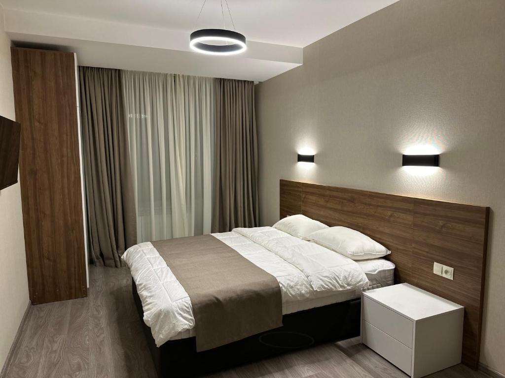 Postel nebo postele na pokoji v ubytování Krystal Bakuriani resort hotel 202C