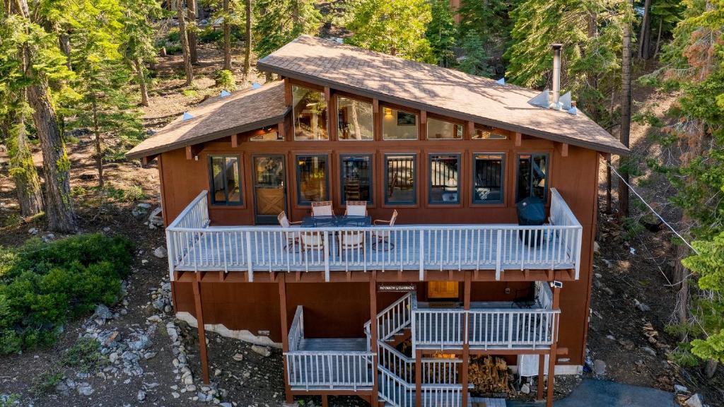 an aerial view of a house in the woods at Tahoe Timber by AvantStay Beach Lake Access in Homewood
