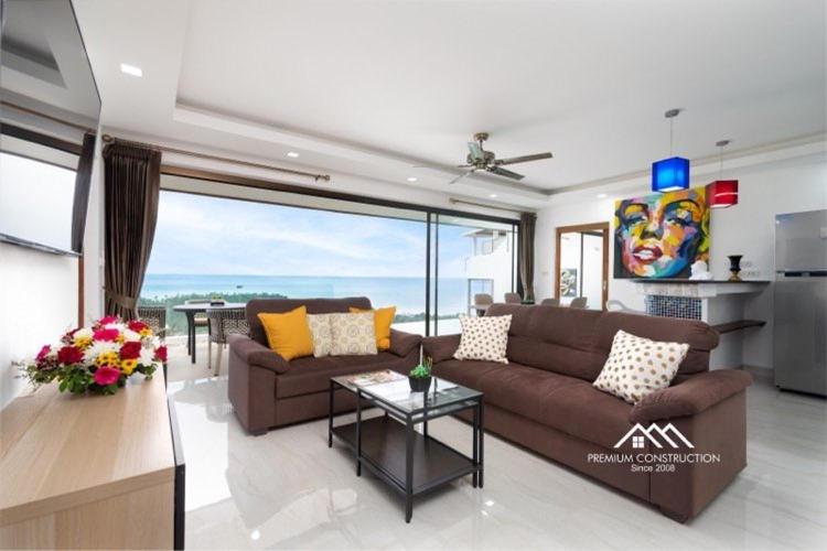 a living room with a couch and a table at Villa Ruby Samantha 2BR with Sea View in Amphoe Koh Samui