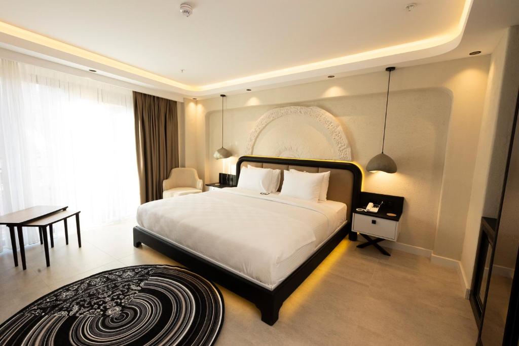 Ένα ή περισσότερα κρεβάτια σε δωμάτιο στο Porto De Galata Hotel