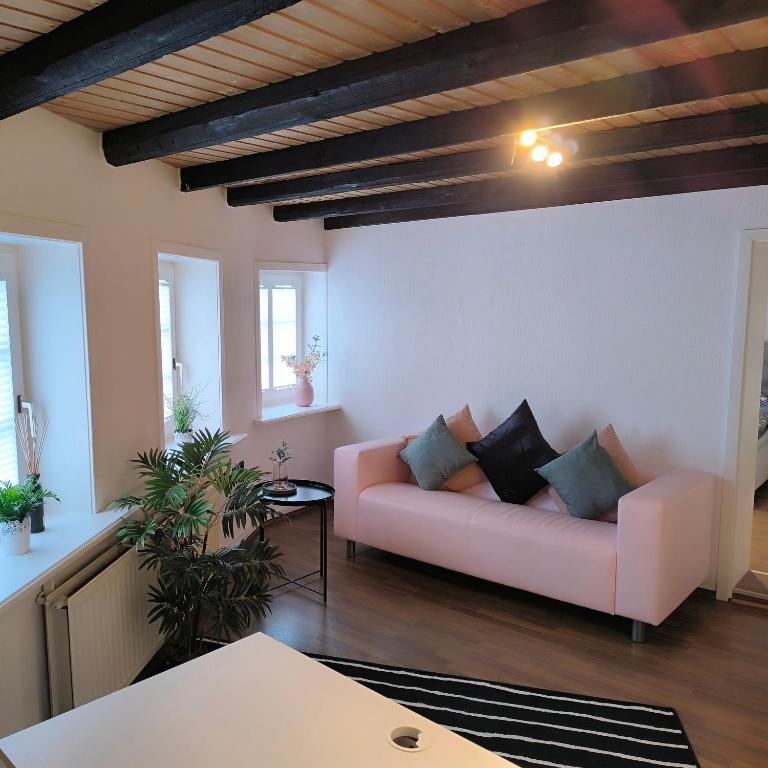 a living room with a couch and a table at Apartment Amsterdam - Berlin in Lügde