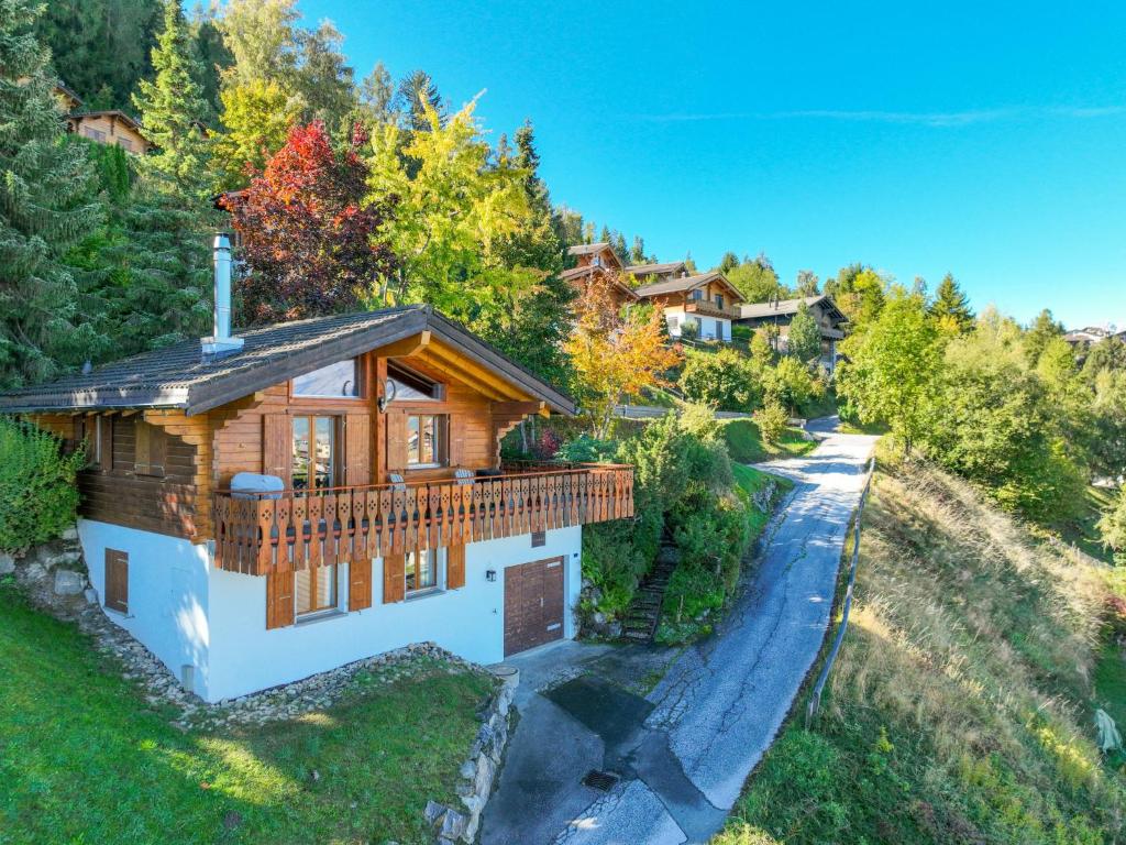 an overhead view of a log home with a driveway at Chalet Dolce Cabane by Interhome in Nendaz