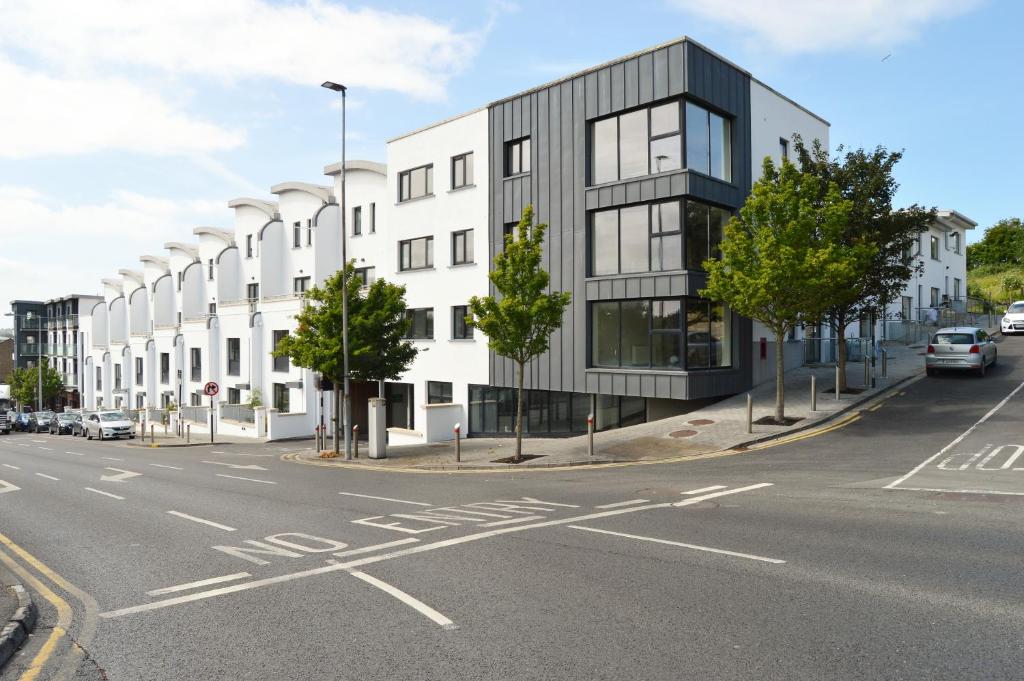 a rendering of a building on a city street at Milligan Court Apartments in Sligo