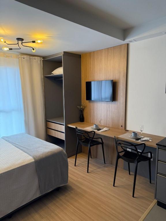 Ένα ή περισσότερα κρεβάτια σε δωμάτιο στο Studio aconchegante, moderno e completo