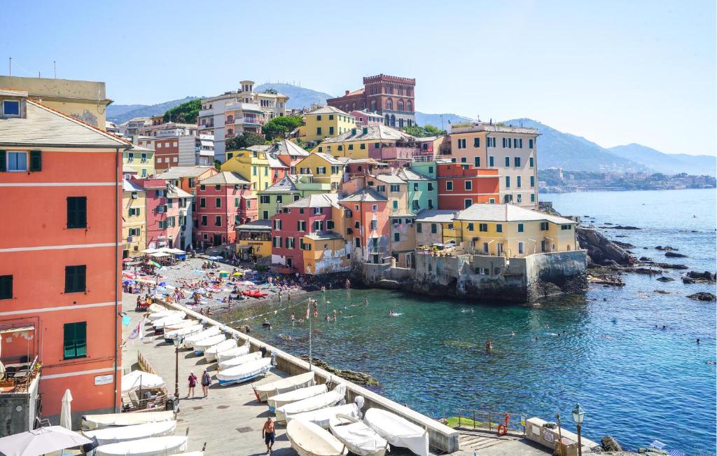 a view of a town with boats in the water at 3 Bedroom Amazing Apartment In Genova in Genova