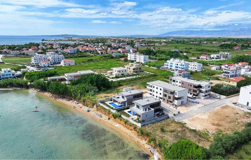 an aerial view of a beach with buildings and the water at Awesome Apartment In Privlaka With Wifi in Glavan