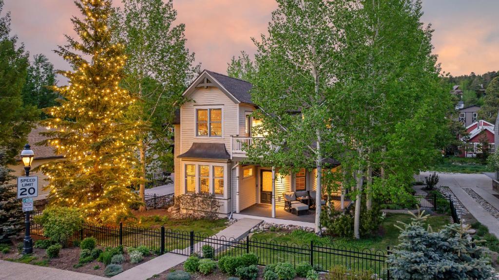 a house with a christmas tree in the yard at Lansdowne Chateau in Breckenridge
