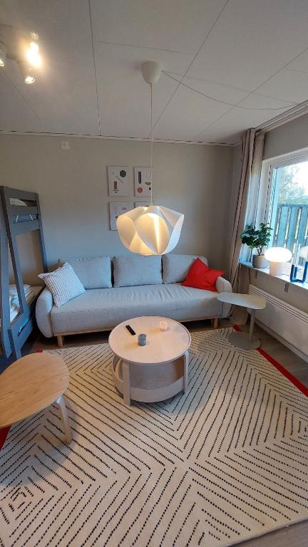 a living room with a couch and a table at 4 Bed apartment close to Branäs - Likemovägen 11C in Likenäs