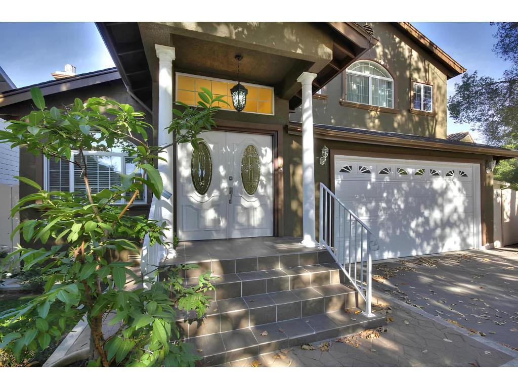 a front door of a house with a gate at Olive Startup House Menlo Park in Menlo Park